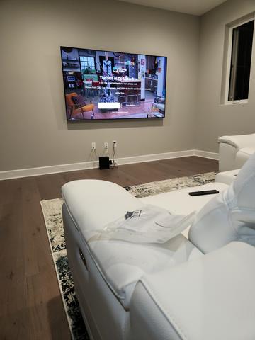 Professional TV wall mounting in a family room