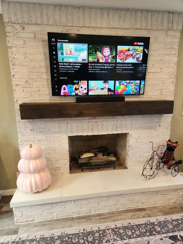 Living room flat-screen mounted flush on the wall
