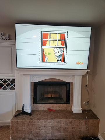 Wall-mounted television with clean lines and leveling