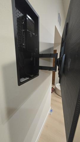 Wall-mounted TV in a bright residential living space