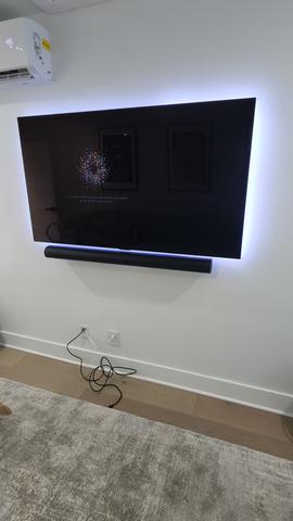 Cable concealment and wire hiding behind a wall-mounted TV